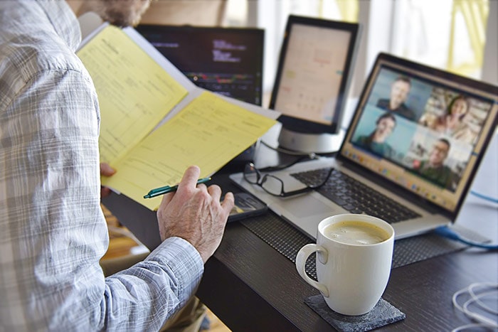 Man working from home, on virtual meeting